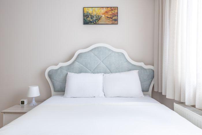 Indulge in luxury and comfort in our stylish bedroom with a queen-size double bed.