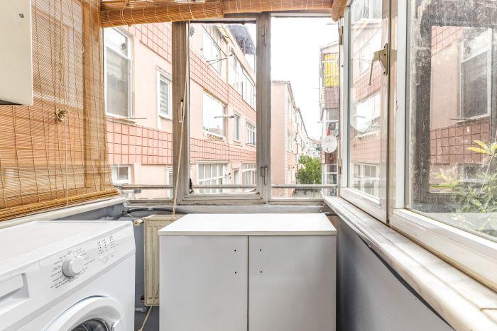 Our flat has a closed balcony that includes a washing machine for your use.