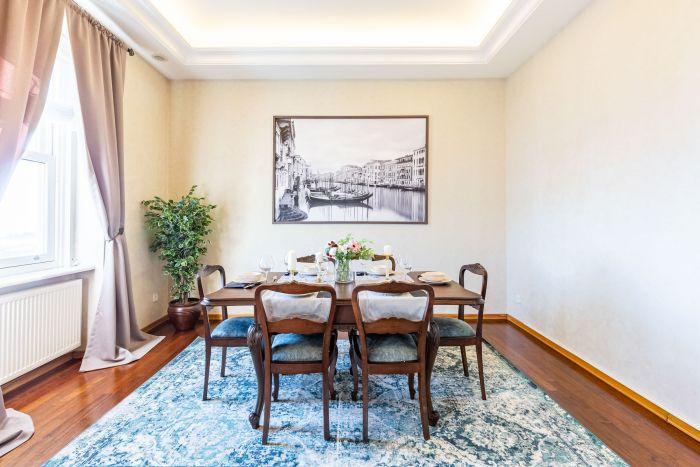 The adjoining dining room is chic and elegant, just like you deserve.