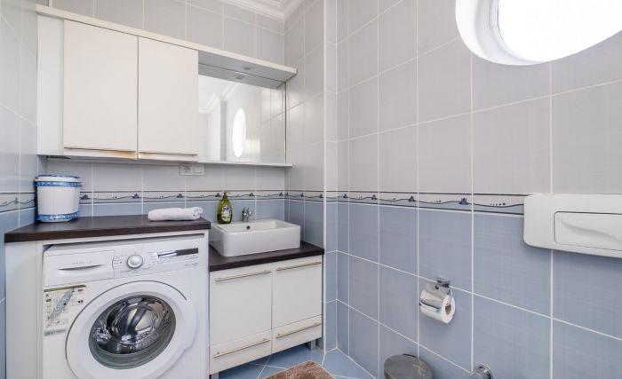 You will find the washing machine in one of our three bathrooms.