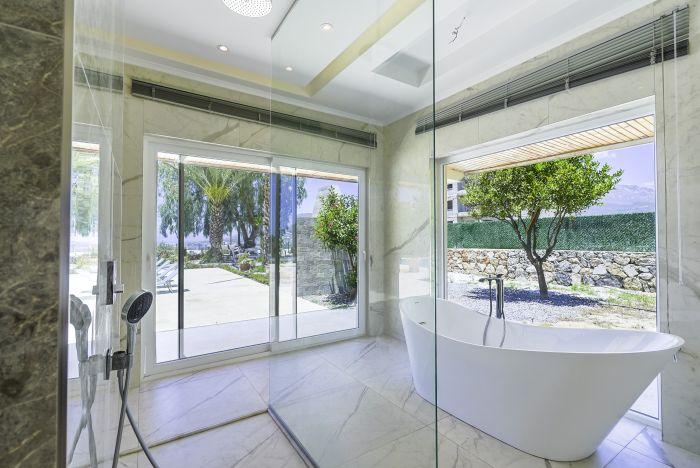 Indulge in a spa-like experience with a private hot tub in our beautifully designed bathroom.