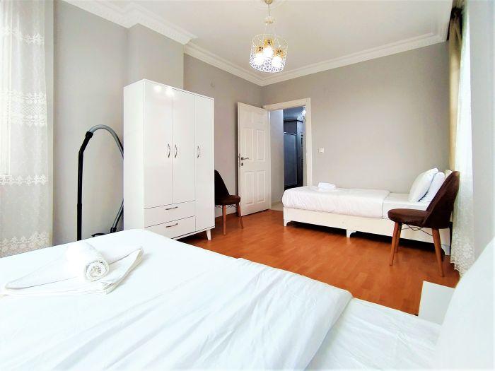 The second bedroom features two single beds and lots of space for your belongings.