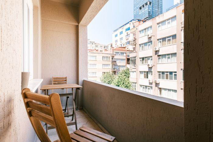 Discover a refreshing urban escape on your private city oasis balcony.