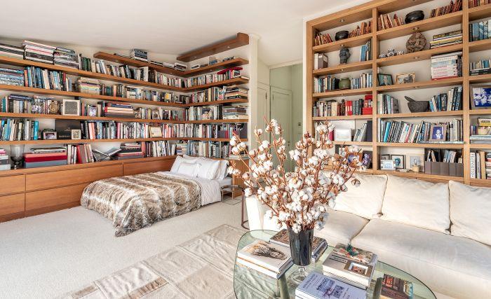 This bedroom includes a tremendous library.