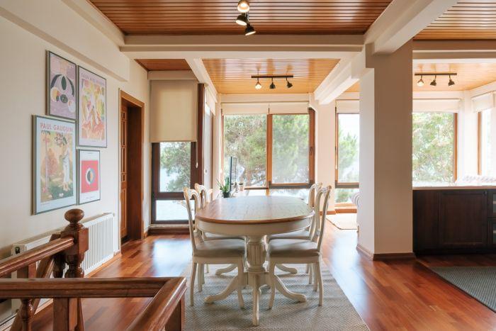 An open-concept living room, seamlessly blending with the dining area for a spacious feel.