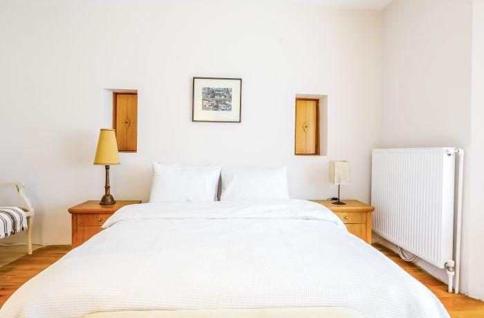 The main bedroom includes a double-sized bed and all furniture for a comfortable night.