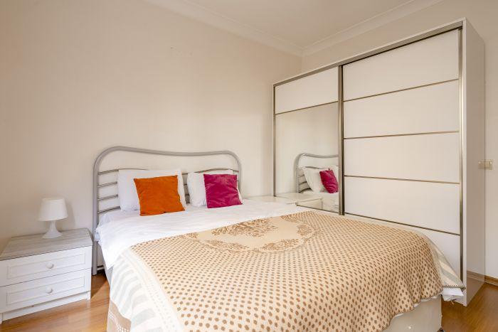 The first bedroom features a comfy double bed and lots of space for your belongings.