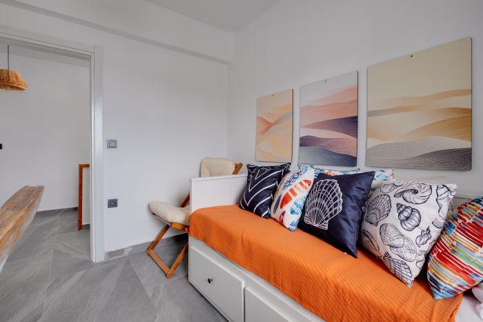 Bright and airy, the third bedroom is a joyful space where guests wake up to the beauty of the sea each morning.