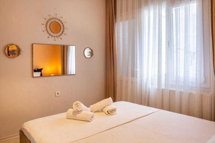 Retreat to our main bedroom featuring a comfortable bed that promises a long and peaceful sleep.
