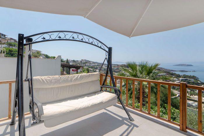 Enjoy morning coffee or evening drinks on our house's balcony, while admiring the captivating sea views.