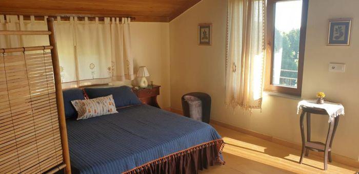 This bedroom features a comfy double bed for your relaxation during your stay.