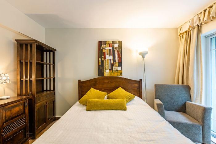 Our bedroom is chic, comfy and inviting you to restful nights.