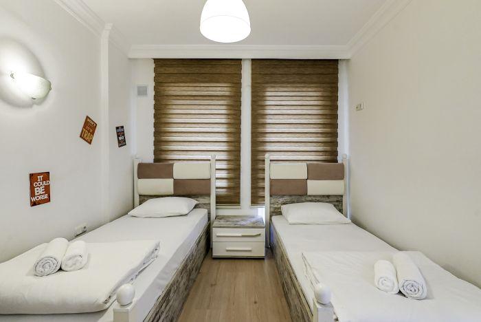 Our second bedroom is at your service with two single beds.
