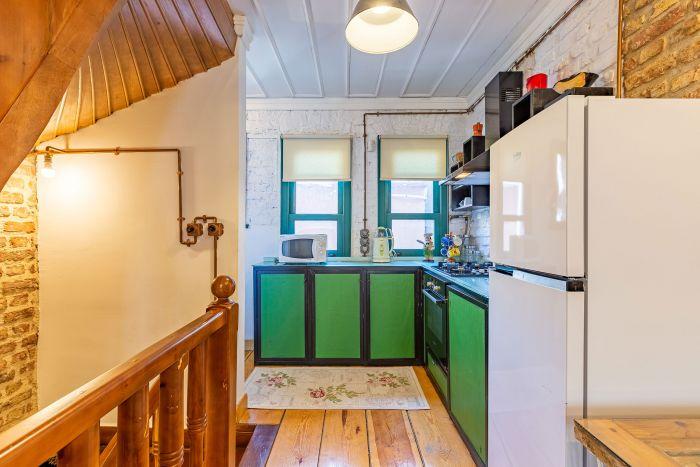 The kitchen is colorful and fully equipped.