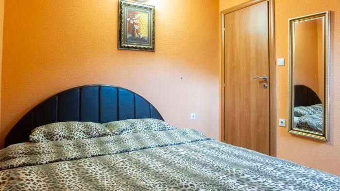 The bedroom features a double bed and all the necessary furniture to feel home comfort.