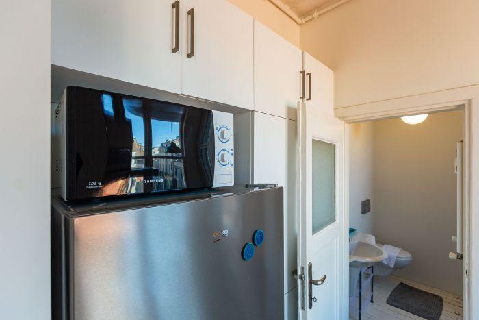 The kitchen includes top-notch white goods and appliances.