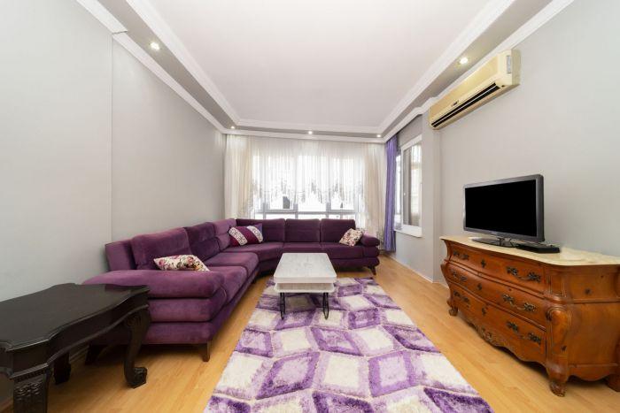Our living room has lovely purple tones, uplifting your energy.
