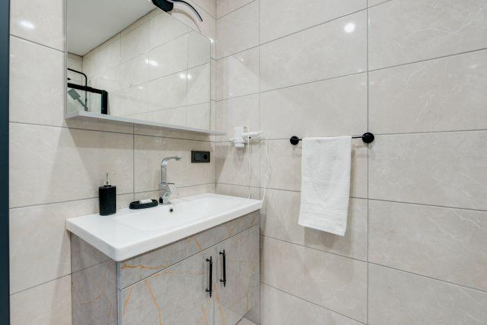 Experience the perfect blend of elegance and practicality in a bathroom designed for comfort and convenience.