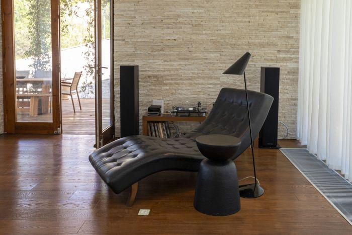 Have a cup of coffee while resting on this elegant lounge chair.