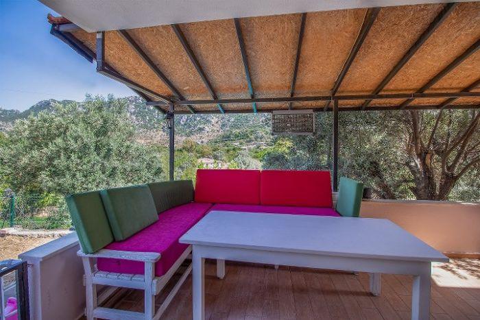 Do you expect a terrace? This villa has a big one with pieces of furniture. 