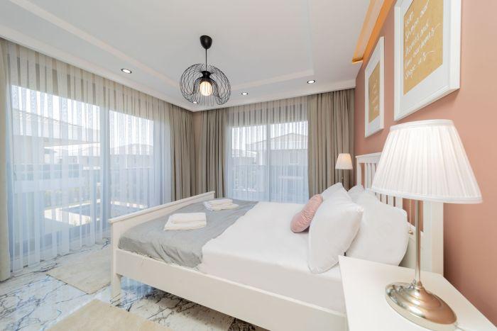 Experience a peaceful night's sleep in our spacious bedroom featuring a plush double bed.