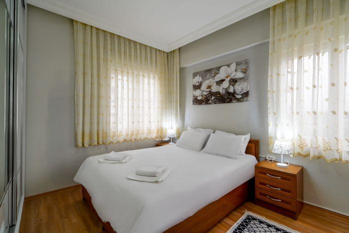 Our bedroom has calming tones of white and yellow for a more soothing atmosphere.
