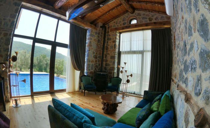 The sofas have a lovely view of the pool and the nature.