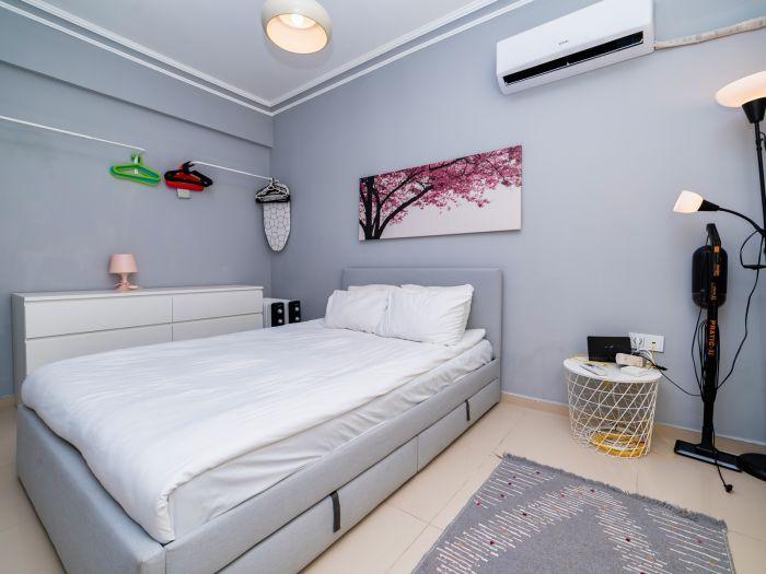 The bedroom features an AC.
