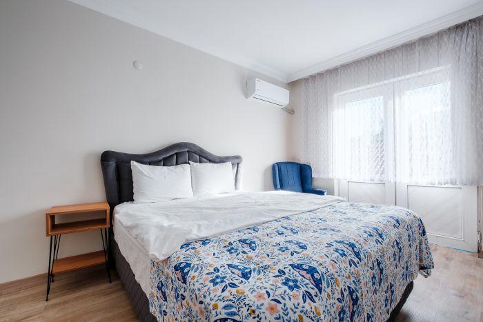 Experience a peaceful night's sleep in our spacious bedroom featuring a plush double bed.