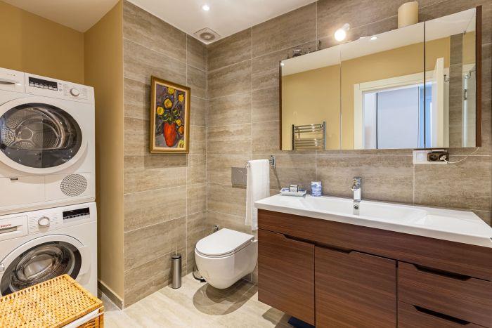 You will find the washing machine and the dryer in our modern and sleek bathroom.