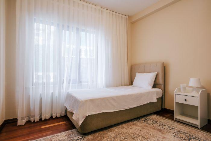 Rest and recharge in our cozy bedroom furnished with a comfortable single bed.