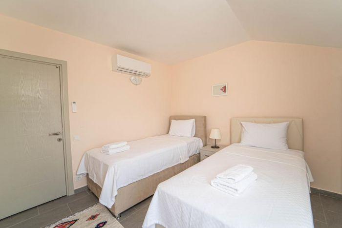 Our second bedroom with an AC has two single beds for your comfort.
