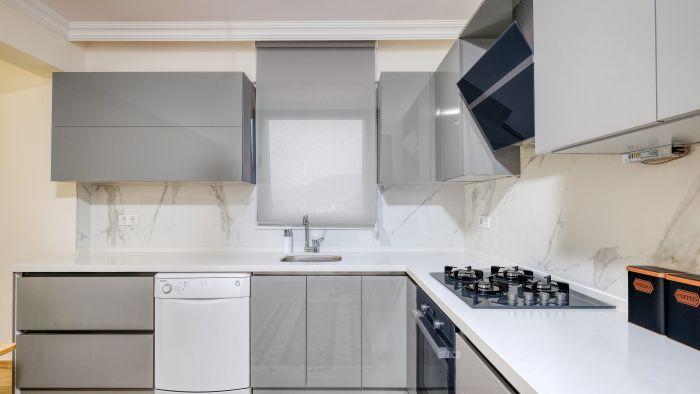 The modern kitchen includes all necessary modern white goods and appliances.